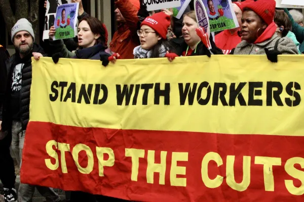 Stand with workers, stop the cuts.