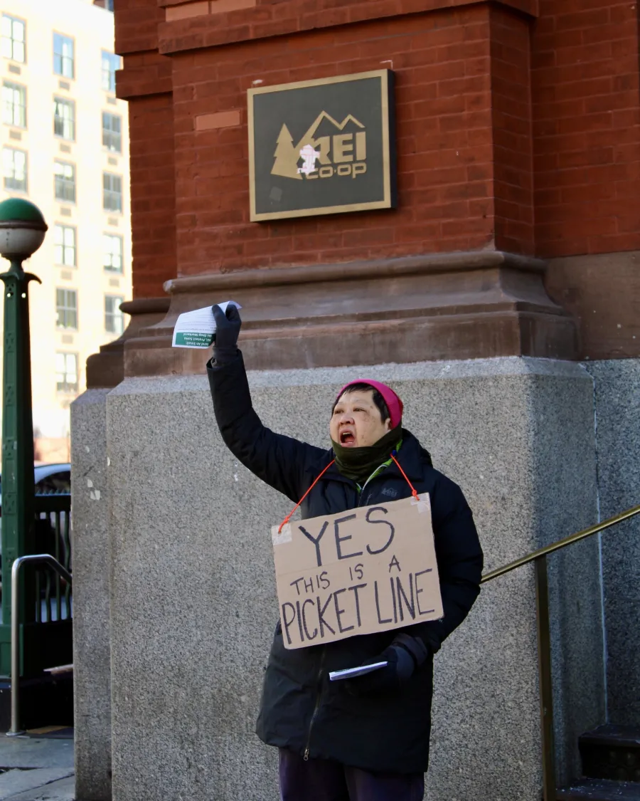 A worker from the REI Ski Shop on strike for safety